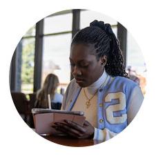 Image of a student studying in the library.